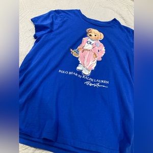 Brand new blue polo shirt, kid’s medium, I wear a xs is women and I fit this.